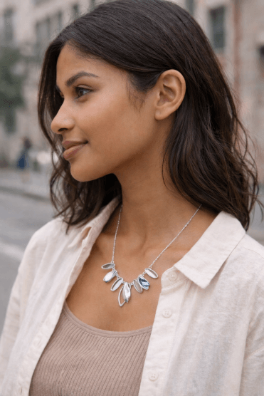 Chic Metallic Cascade Necklace With Leafy Charms